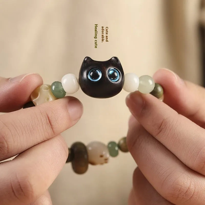 Hand-woven beaded bracelet with a cat's paw charm, jade, and wood beads in a cartoon style.