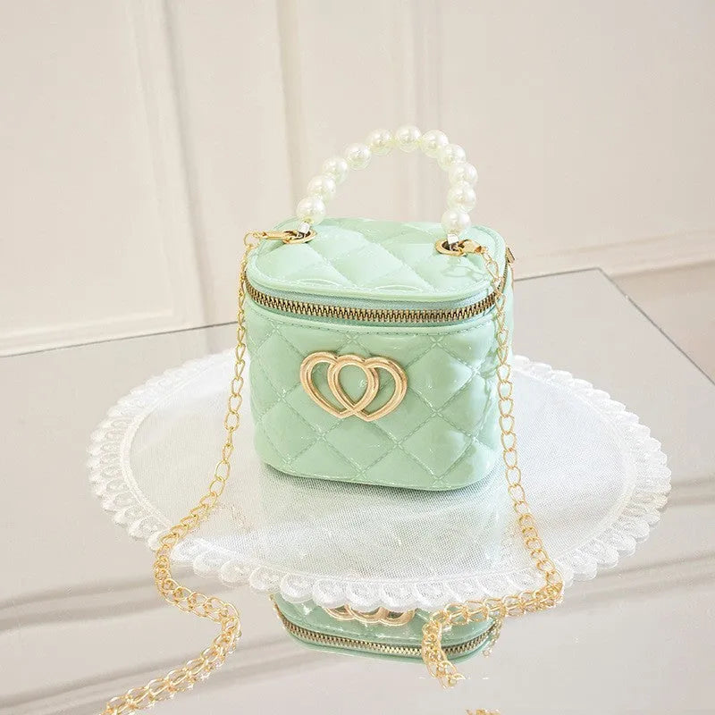 PVC bucket-shaped gel bag for women with a heart pattern, shown in apricot colour.