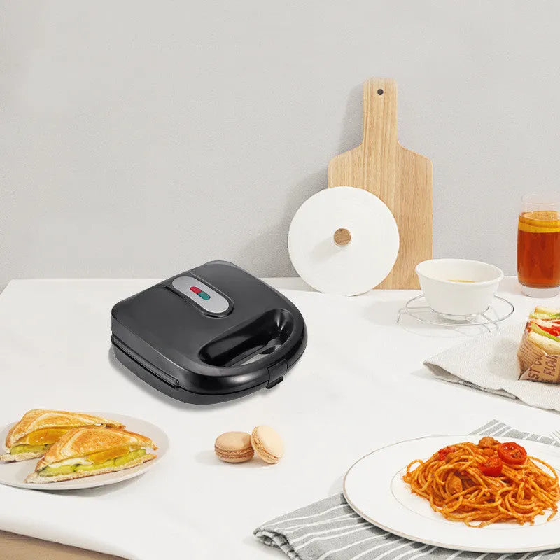 Black double-sided electric sandwich maker with stainless steel lid and six round non-stick cooking plates.