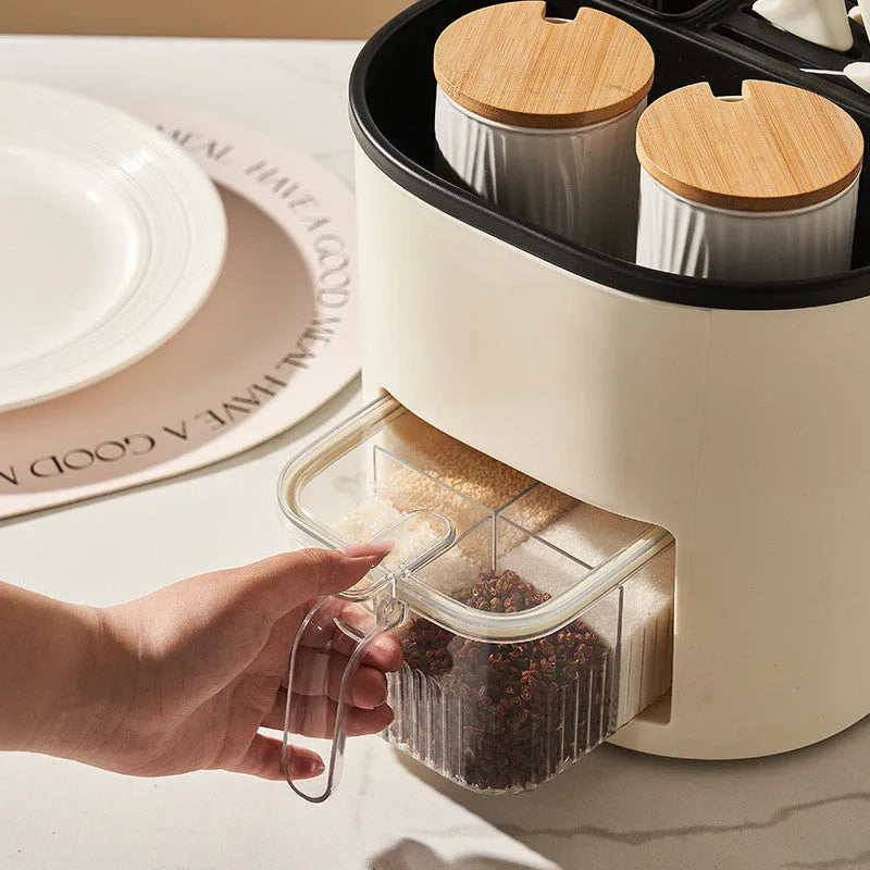 White rotating kitchen storage bucket with an integrated four-section spice box for cutlery and seasoning organisation.