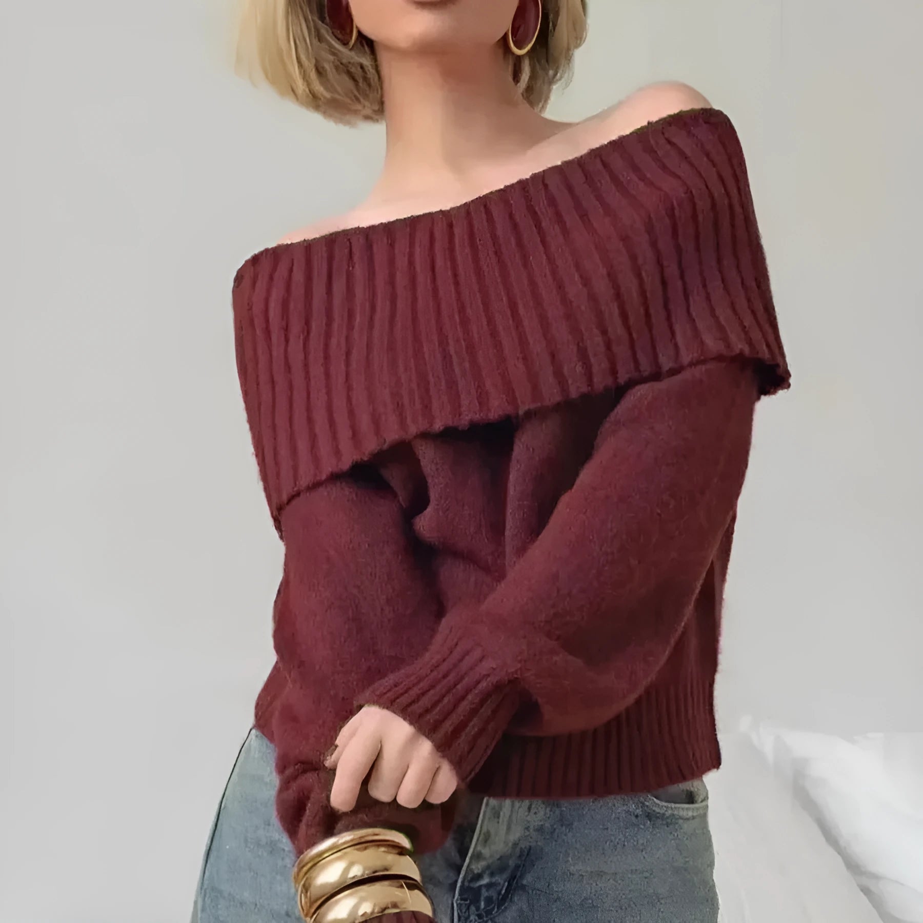 Grey off-the-shoulder women's sweater with a textured 3D rib knit pattern.