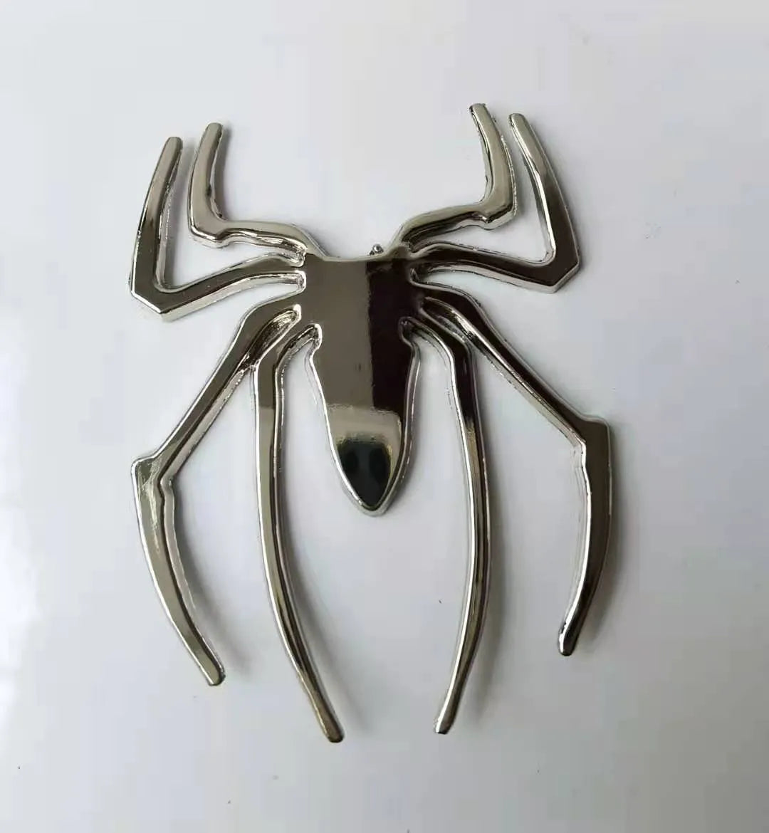 Zinc alloy 3D spider car bumper sticker in gold, silver, black, and red colours.