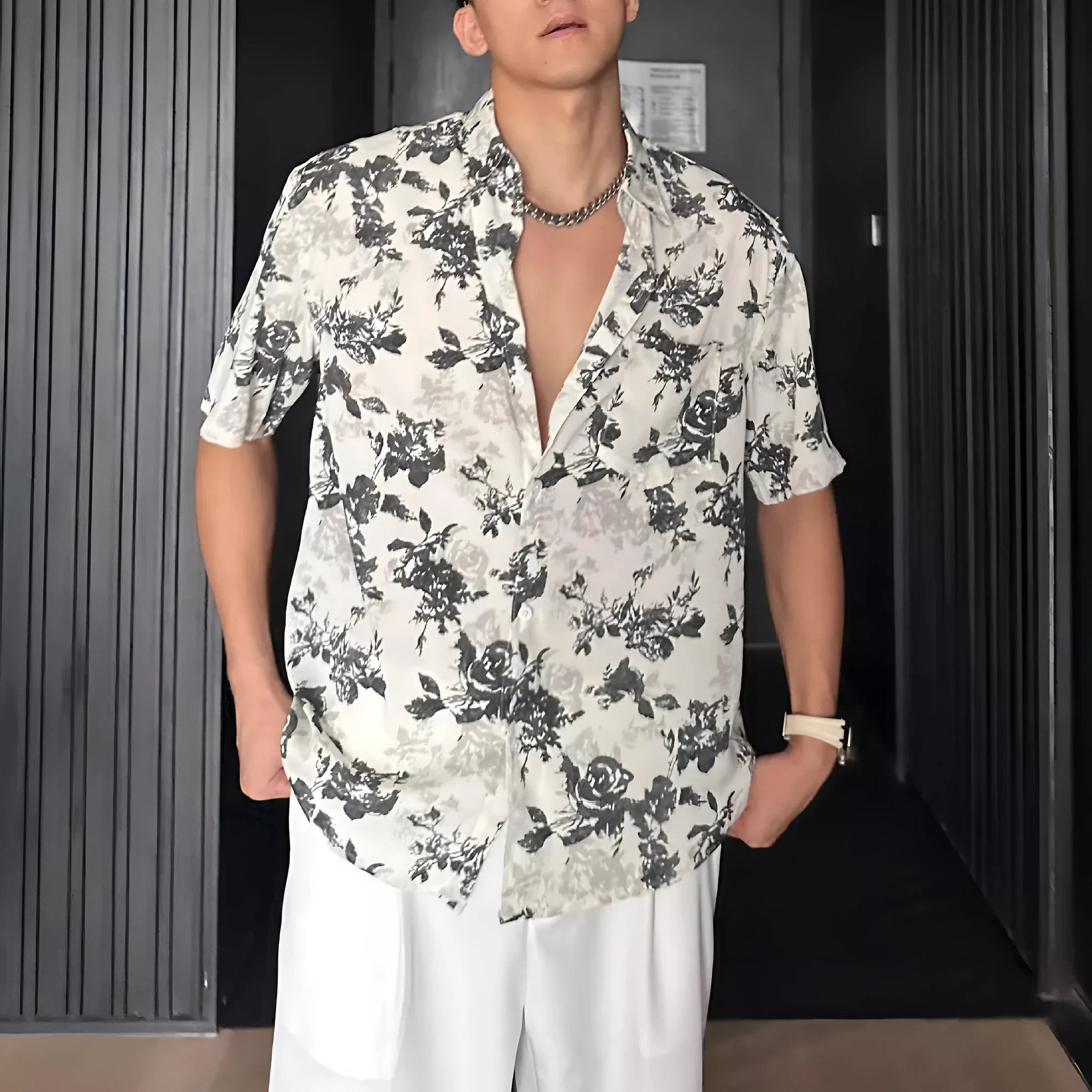 White loose-fit short sleeve casual shirt with a floral print and an open cardigan style front.