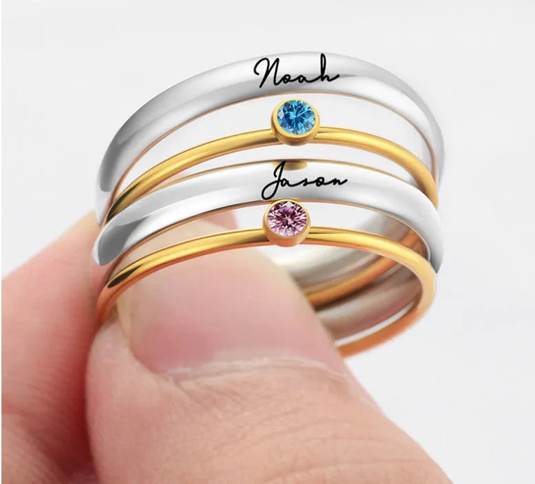 December colour birthstone engraved titanium steel ring with geometry shape on a grey background.