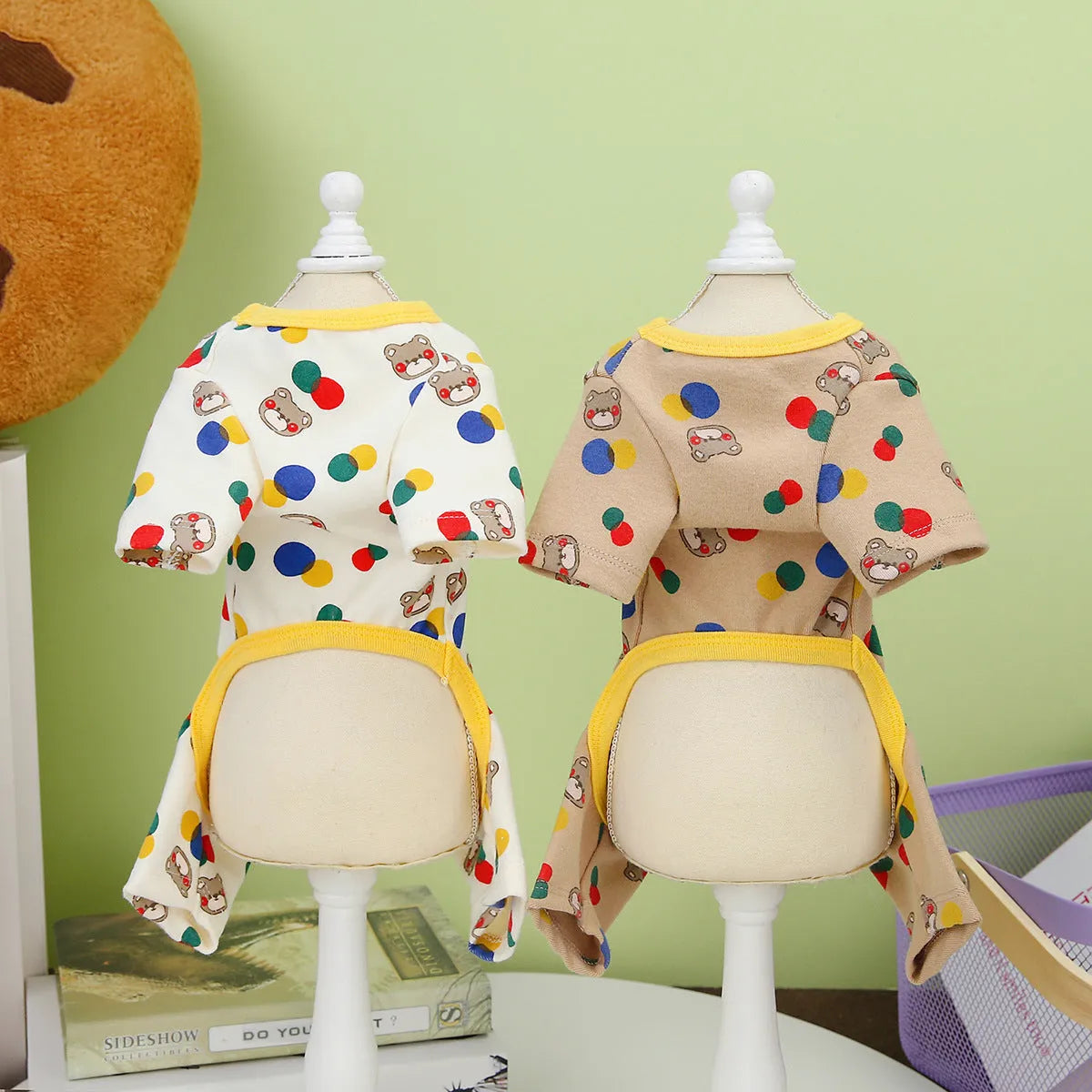 Beige dog t-shirt with a colourful cartoon bear print, showing a casual fit on a pet.