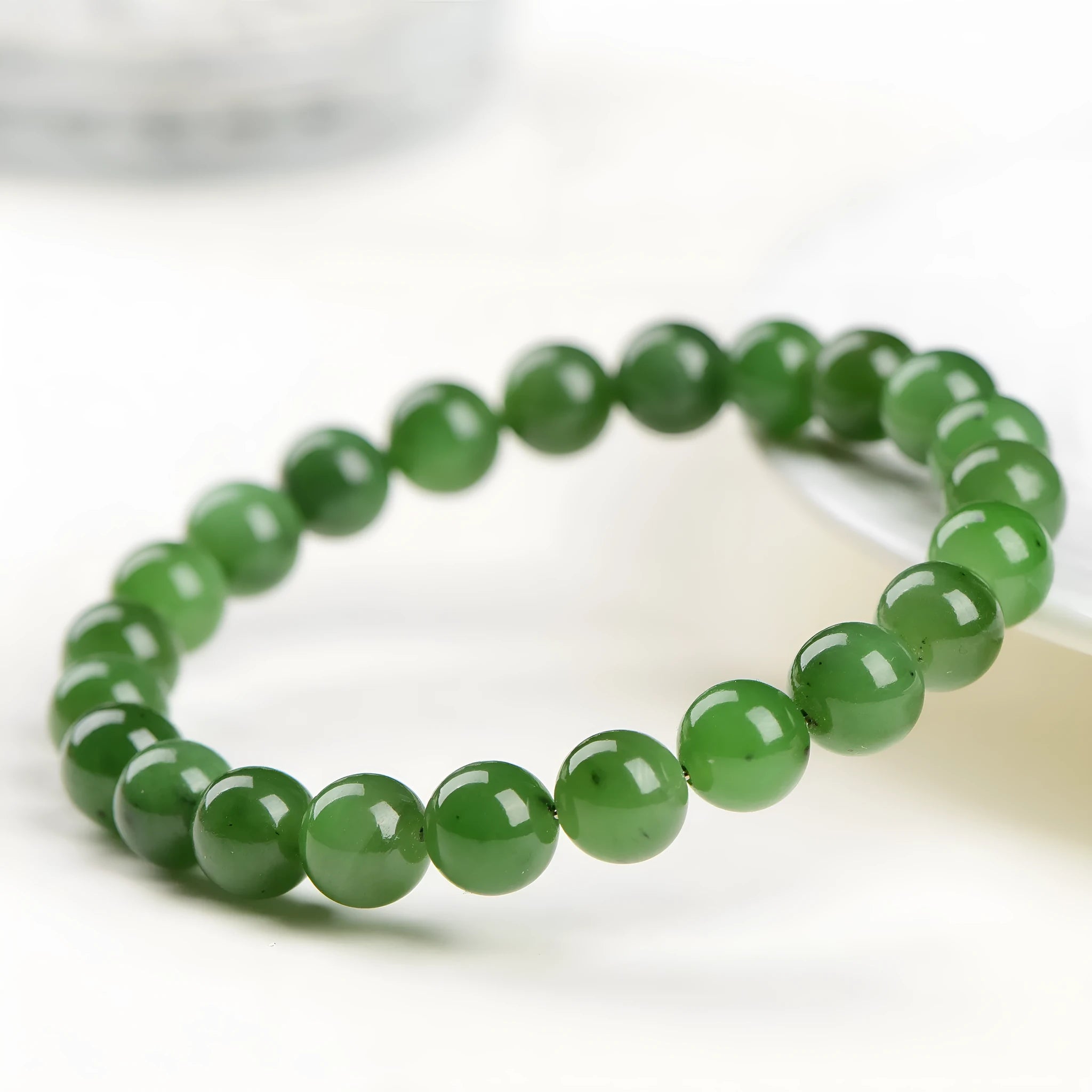 Natural jasper ball bracelet showing polished stone beads in one of five available sizes.