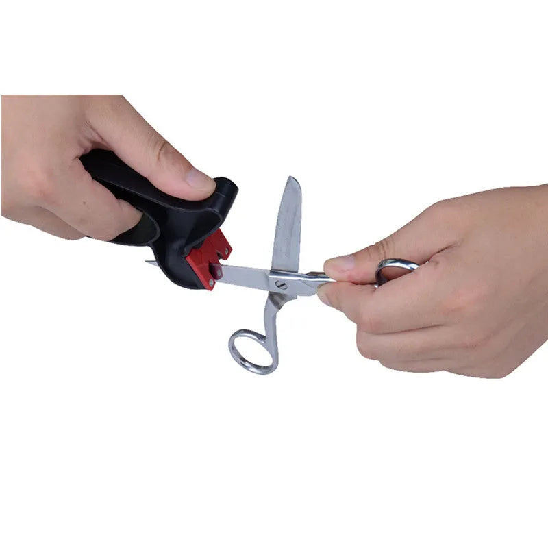 Black handheld knife and scissor sharpener with tungsten steel blade on white background