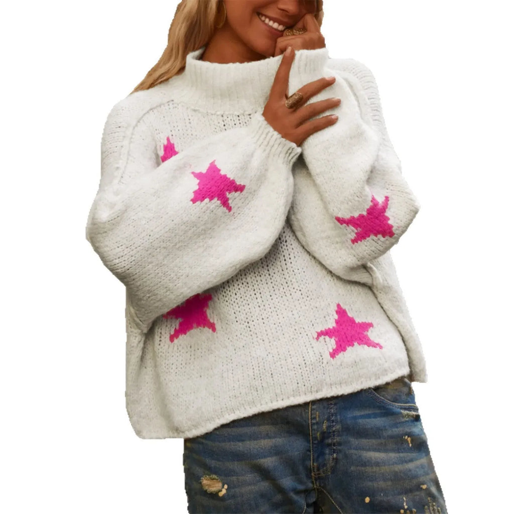 White women's loose turtleneck pullover with a black five-pointed star pattern on the front.