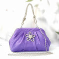 Soft black polyester women's shoulder messenger bag showing chain detail and fold styling.