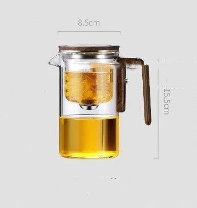 Chinese-style glass teapot with wooden handle showing magnetic filtration button and inner infuser container.