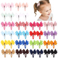 40 colourful grosgrain ribbon baby hair bows with soft wrapped snap clips.