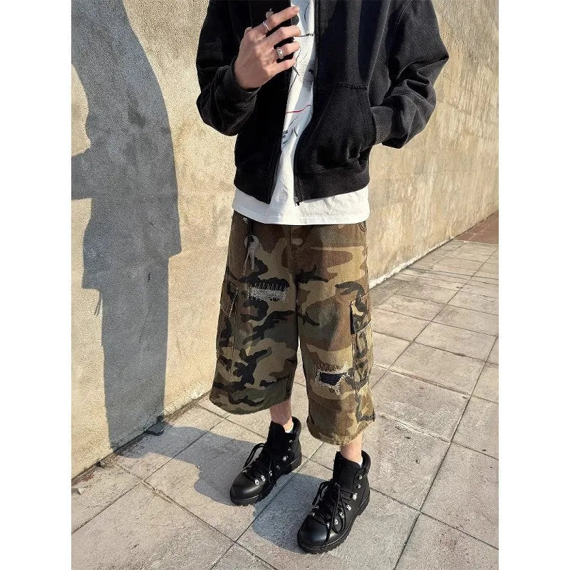 Men's camouflage cropped pants with ripped patches and straight leg cut