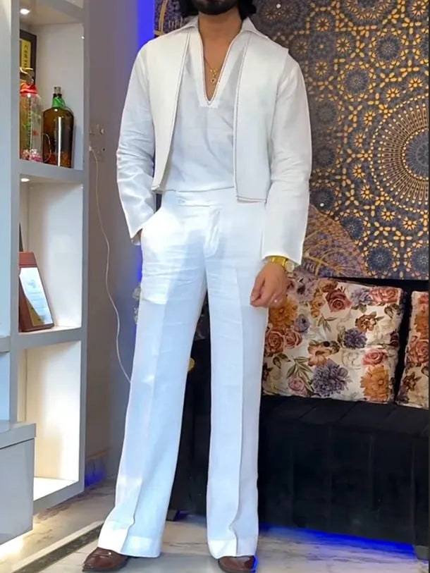 White women's three-piece outfit comprising a V-neck shirt, sleeveless vest, and full-length trousers.