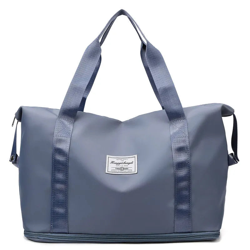 Large capacity Oxford cloth shoulder bag in lake green with multiple zippered pockets for travel