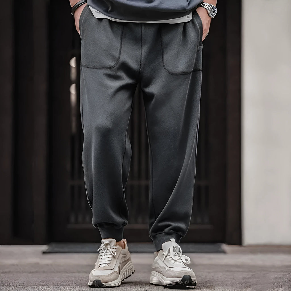 Retro men's tapered ankle-tied sweatpants in dark gray with drawstring elastic waist