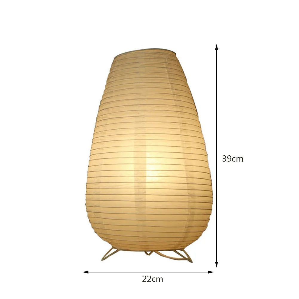 White rice paper plug-in table lamp with traditional shade on wooden surface