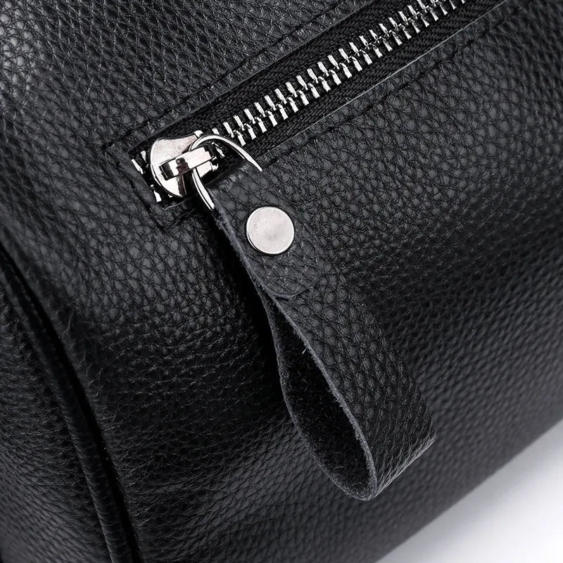 Black genuine leather one-shoulder crossbody bag with a single strap.