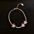 Gold-coloured copper bracelet with geometric quadrilateral pattern and zircon inlaid detailing for women's fashion wear