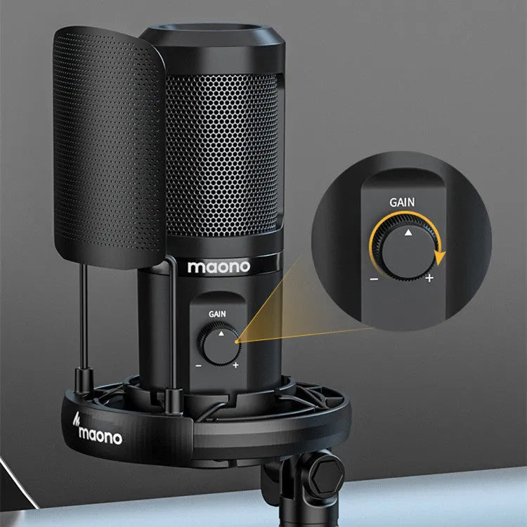Black USB condenser microphone on a tripod with shock mount, next to a USB cable.