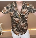 Men's printed casual button-down shirt with spread collar and chest pocket.