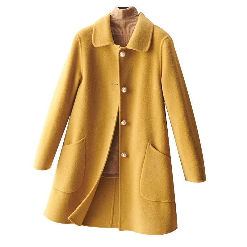 Women's mid-length wool coat with pearl buckle fastening and doll collar in solid colour
