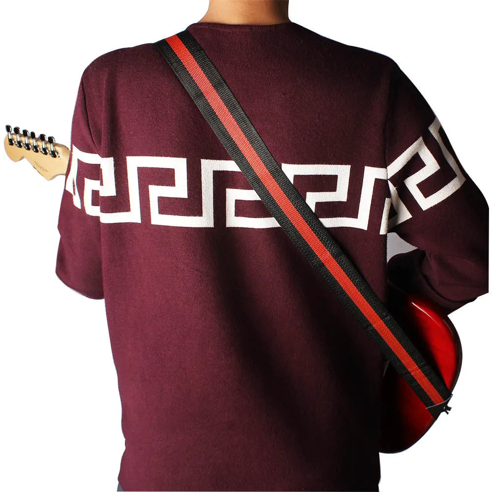 Woven crossbody instrument strap with stripe pattern in army green colour for guitar or ukulele.