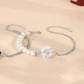 Close-up of a 925 sterling silver bracelet with a snake design, obsidian pearl, and a safe buckle clasp.