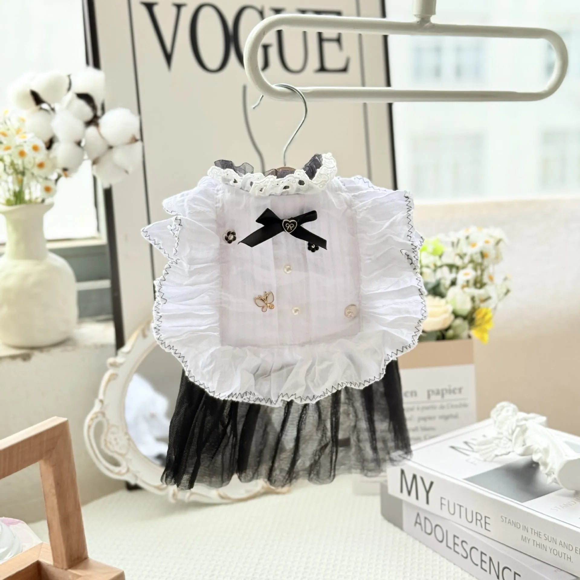 White polyester waltz gauze skirt princess dress for a small dog on a hanger.