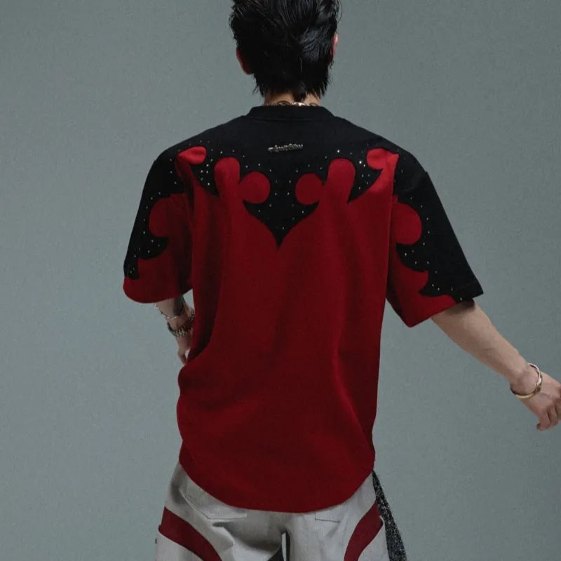 Men's grey loose fit cotton t-shirt with burnt flower stitching and rhinestone detail on the chest.
