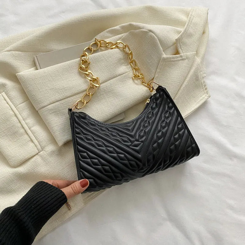 Vertical brown PU leather women's shoulder bag with a pleated front, chain strap, and soft handle.
