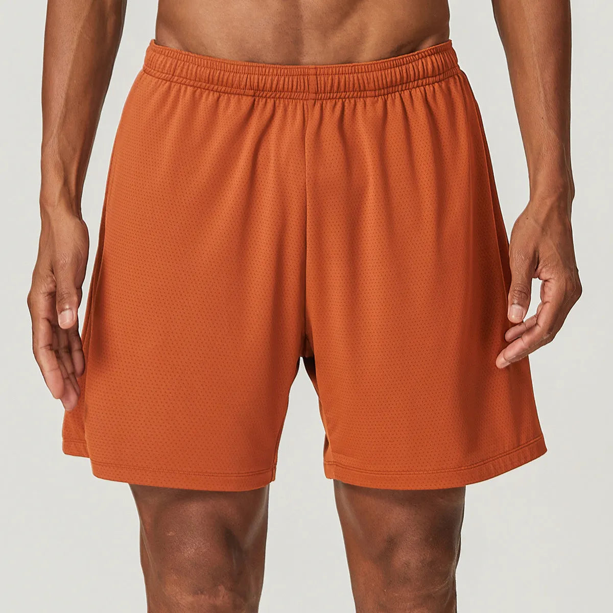 Men's double-layer running shorts in sky green colour on a mannequin, showing mid-waist and shorts length.