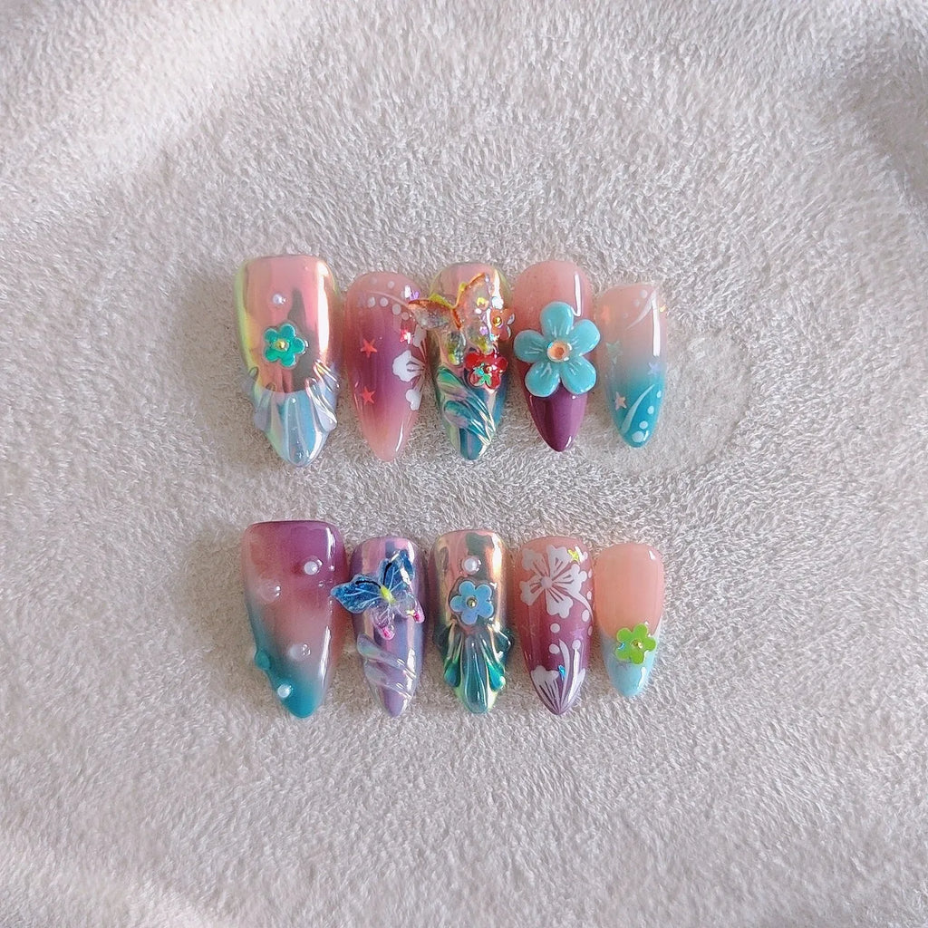 Handmade colourful nail art set with embossed small flower and butterfly sculptures for almond-shaped manicures.