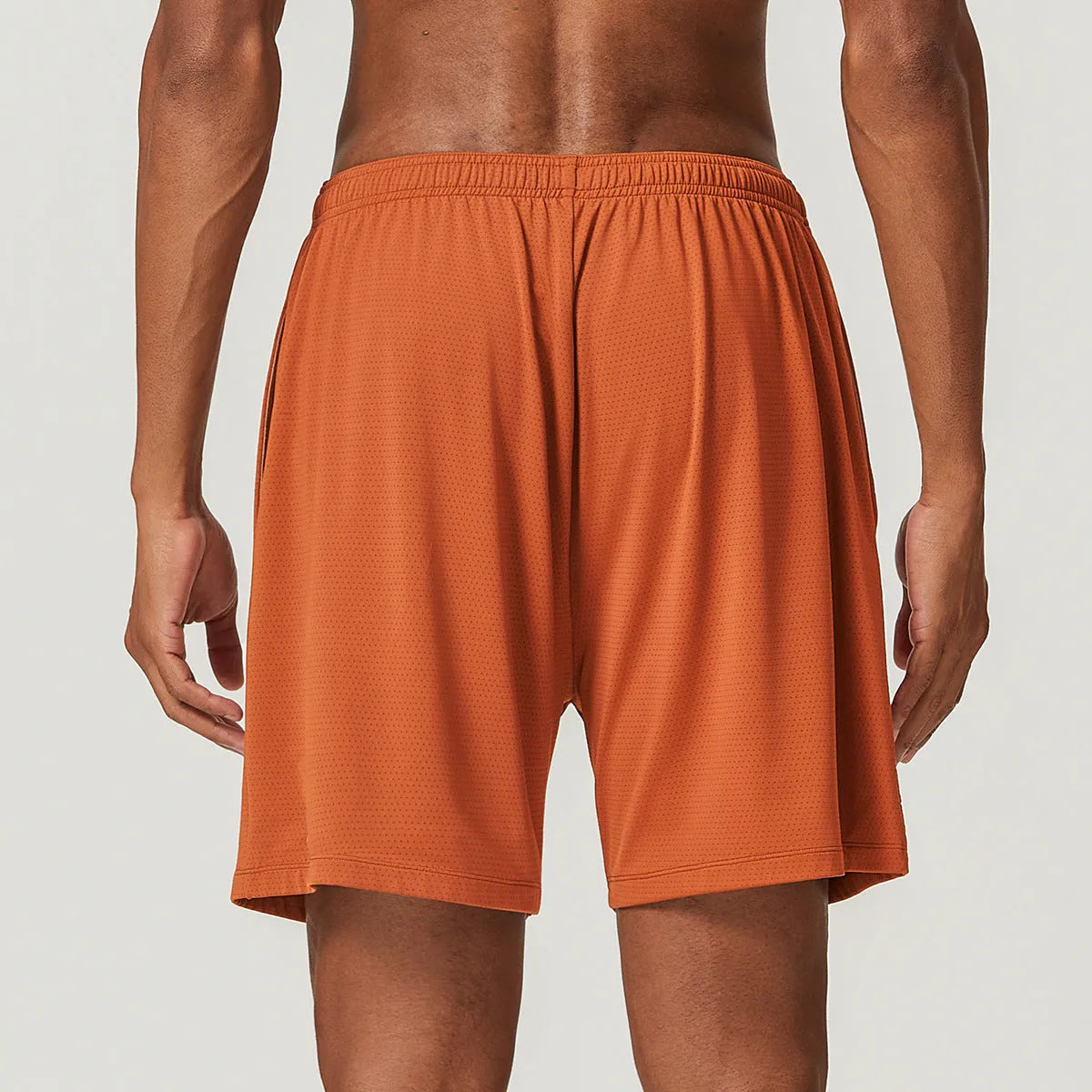 Men's double-layer running shorts in sky green colour on a mannequin, showing mid-waist and shorts length.