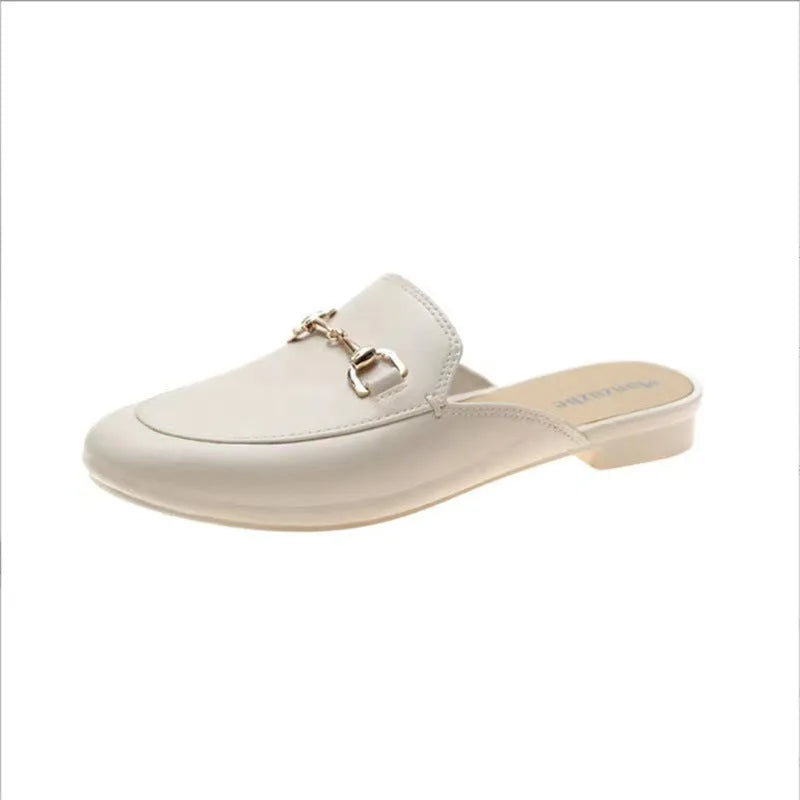 Women's closed toe PVC half slipper in milky white with a double buckle fastening.