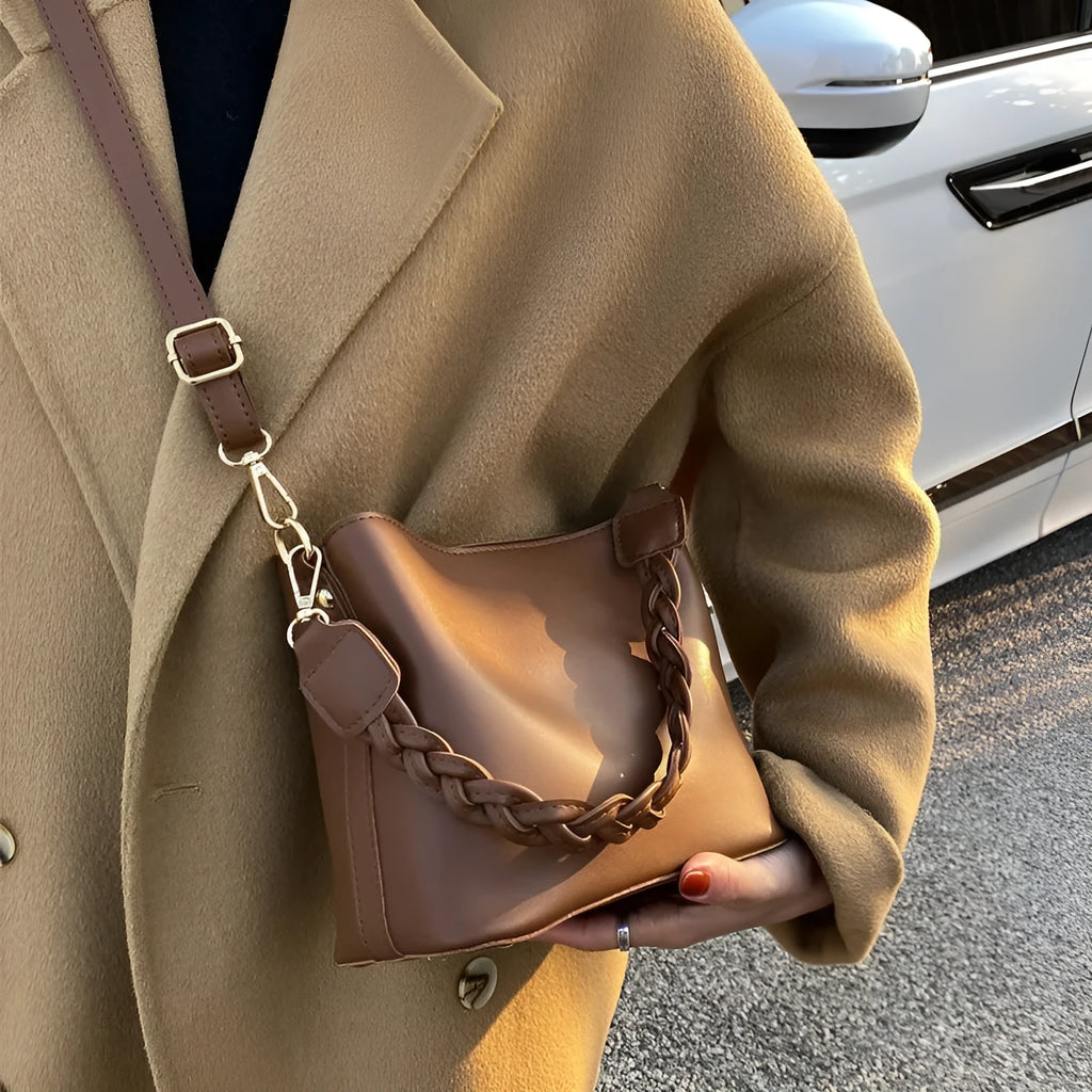 Retro style woven PU one-shoulder crossbody bucket bag in khaki colour.