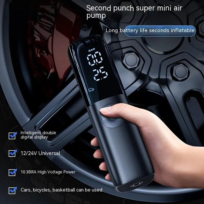 Black portable electric car air pump with tyre pressure gauge and inflation hose.