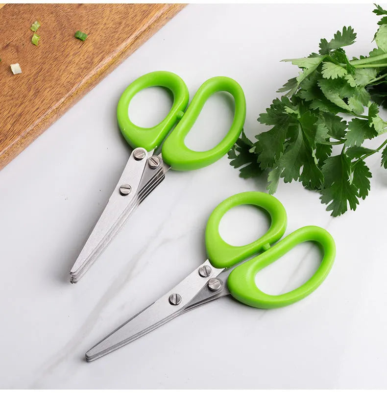 Stainless steel multi-layer herb scissors with green handles for chopping green onions and seaweed.