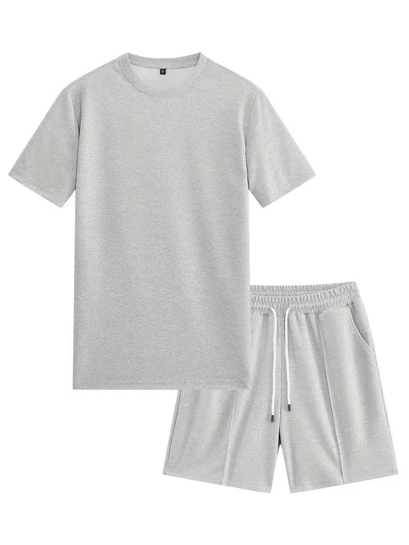 Man wearing a light waffle-texture short sleeve blouse and matching shorts in apricot colour.