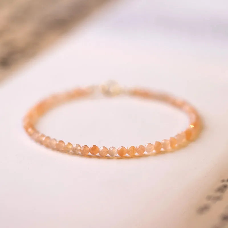Sunstone crystal fortune bracelet with 3mm ultra-thin beads on female wrist