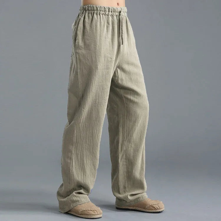 Men's linen loose casual sports pants in khaki, side view, on a hanger