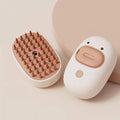 White or yellow rechargeable steam pet brush for dogs and cats on a plain background