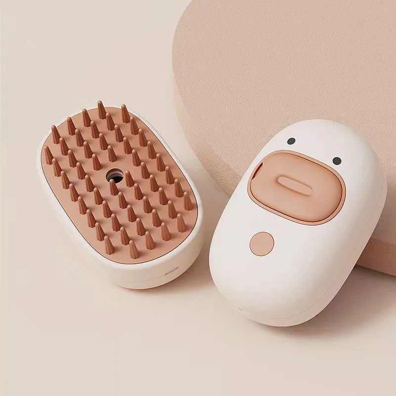 White or yellow rechargeable steam pet brush for dogs and cats on a plain background