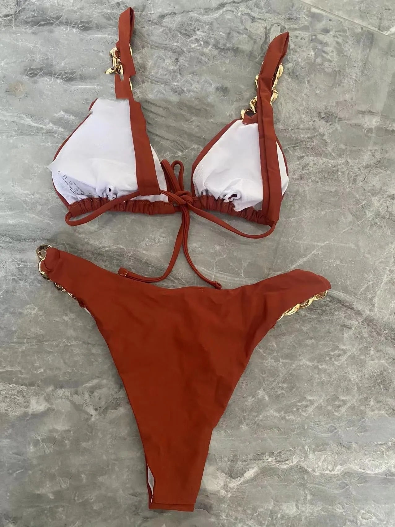Brown women's tube-top push-up bikini swimsuit with a ring tether detail.