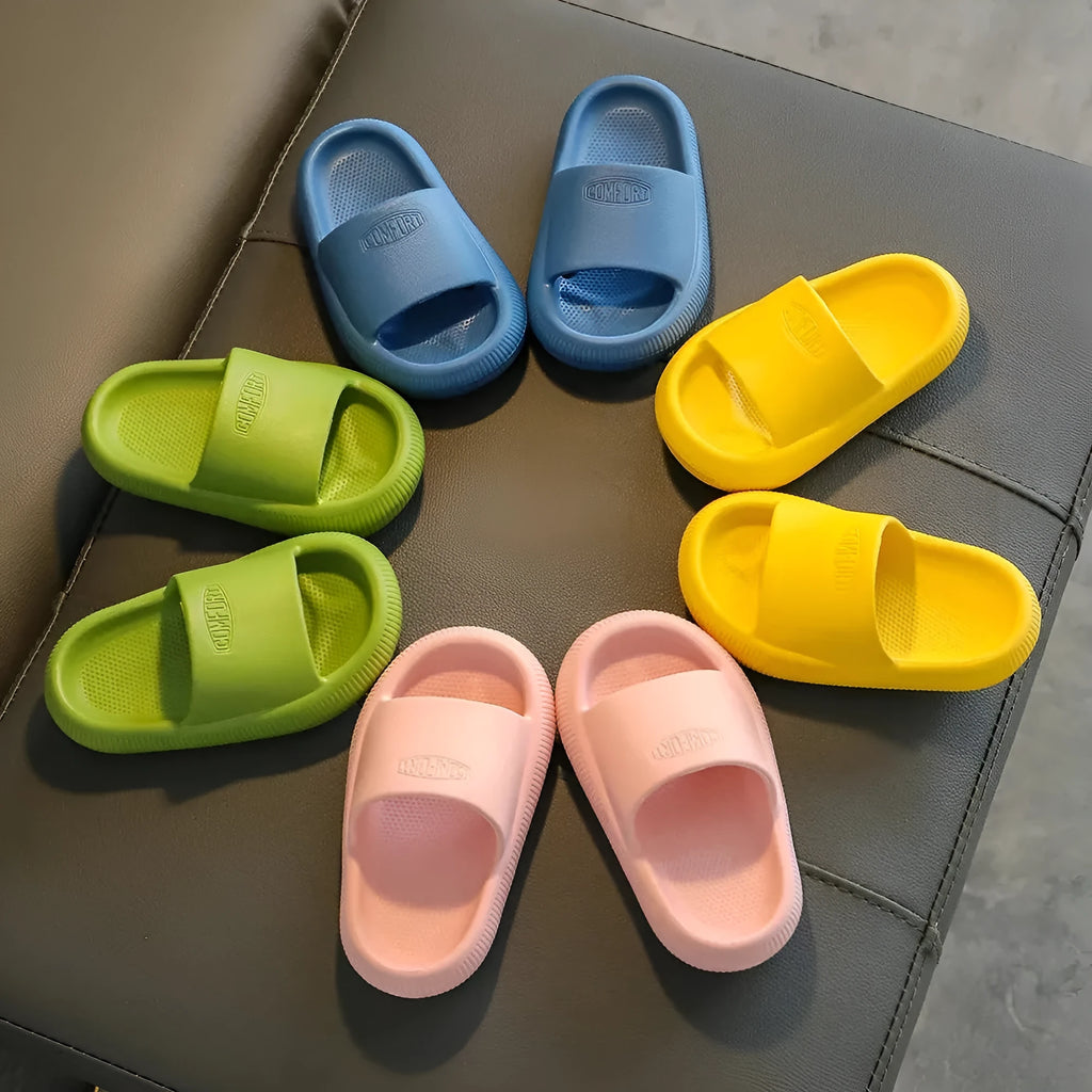 Children's colourful EVA slippers with a textured non-slip sole, shown in a mixed colour selection.