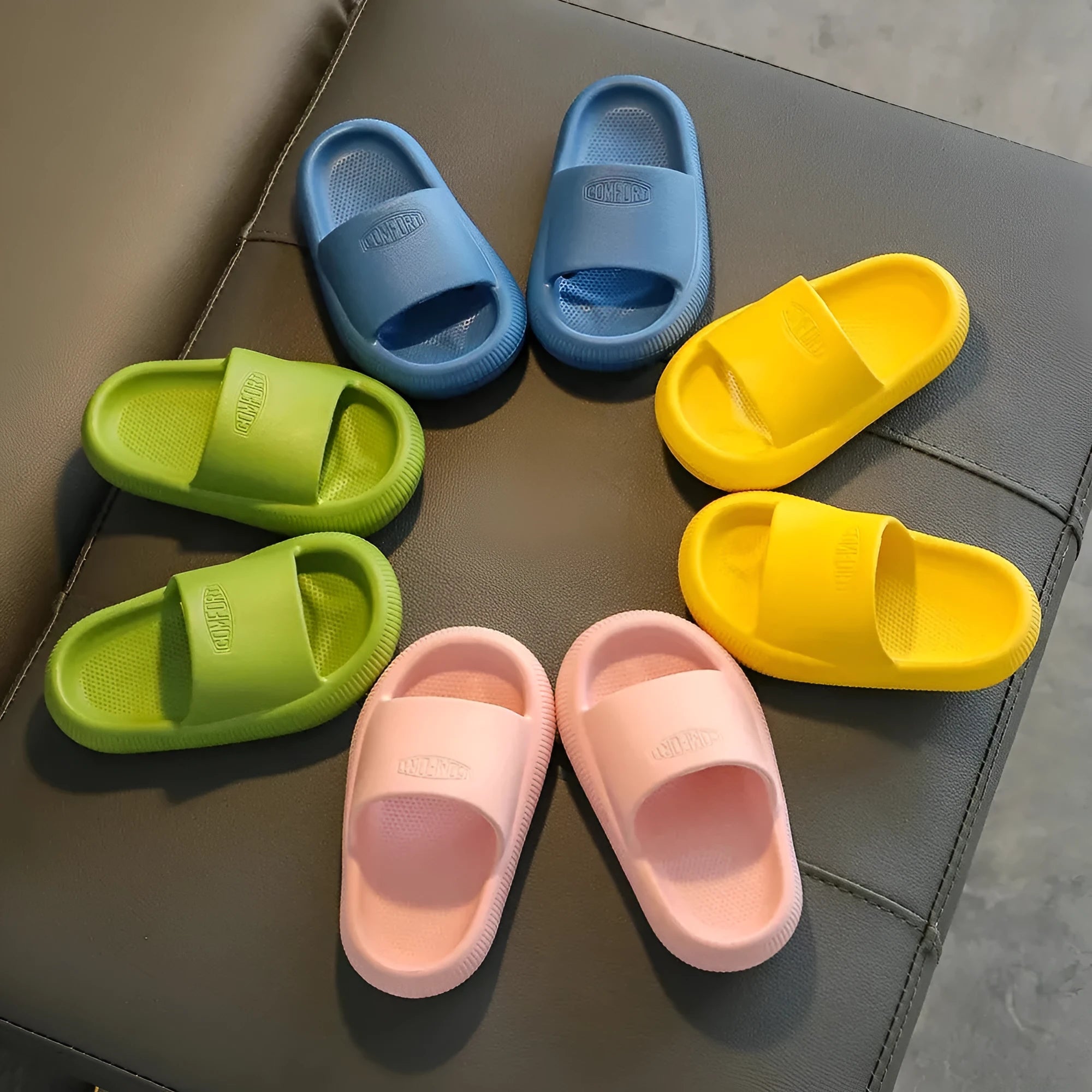 Children's colourful EVA slippers with a textured non-slip sole, shown in a mixed colour selection.