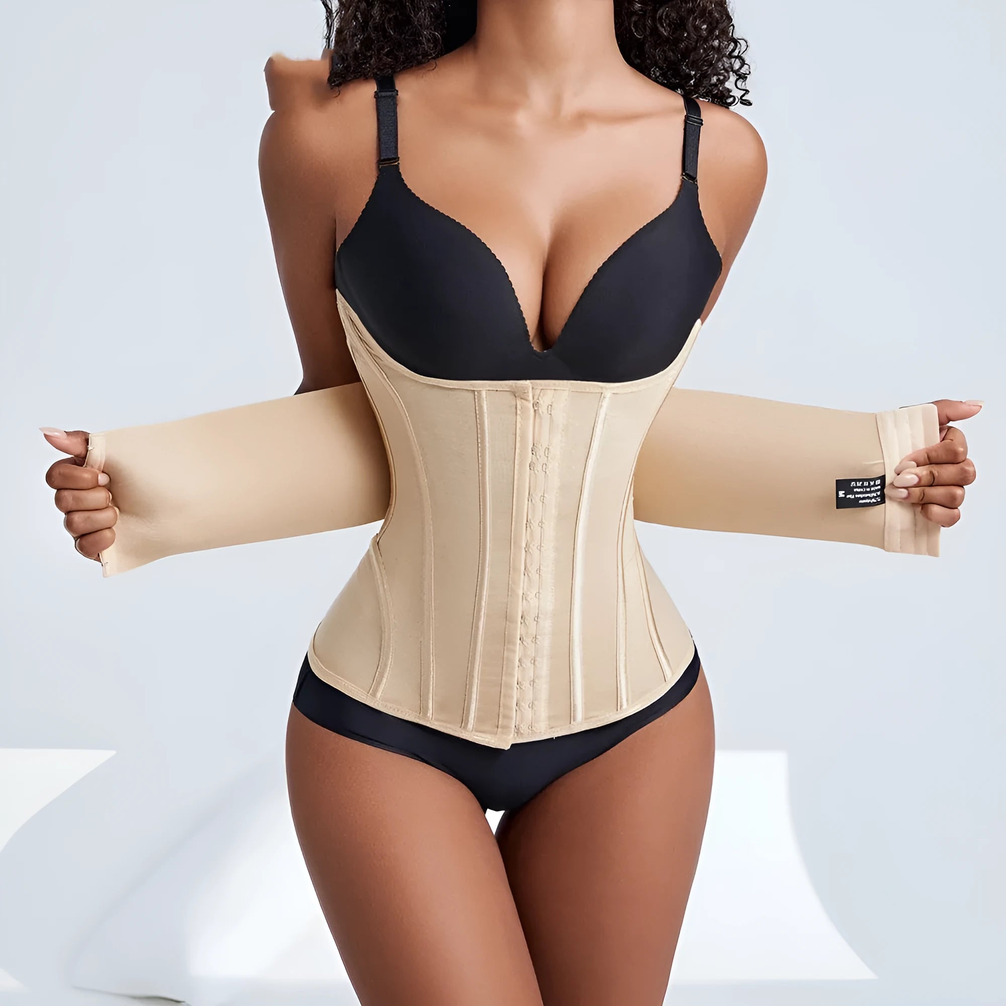 Black adjustable nylon belly band for waist training, shown with its belt tie, on a mannequin.