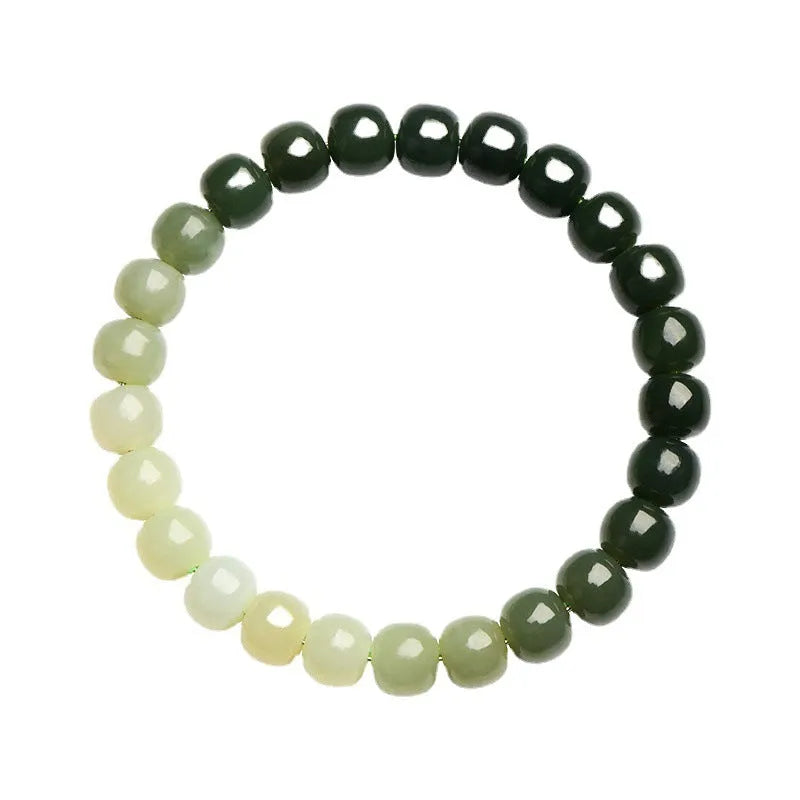 Natural Hetian Jade bracelet with gradient clear water colour on wrist, showing polished beads.