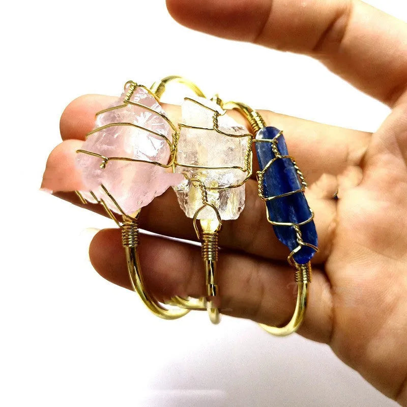 Geometric bracelet made of natural rough crystal stones wrapped with gold-coloured wire