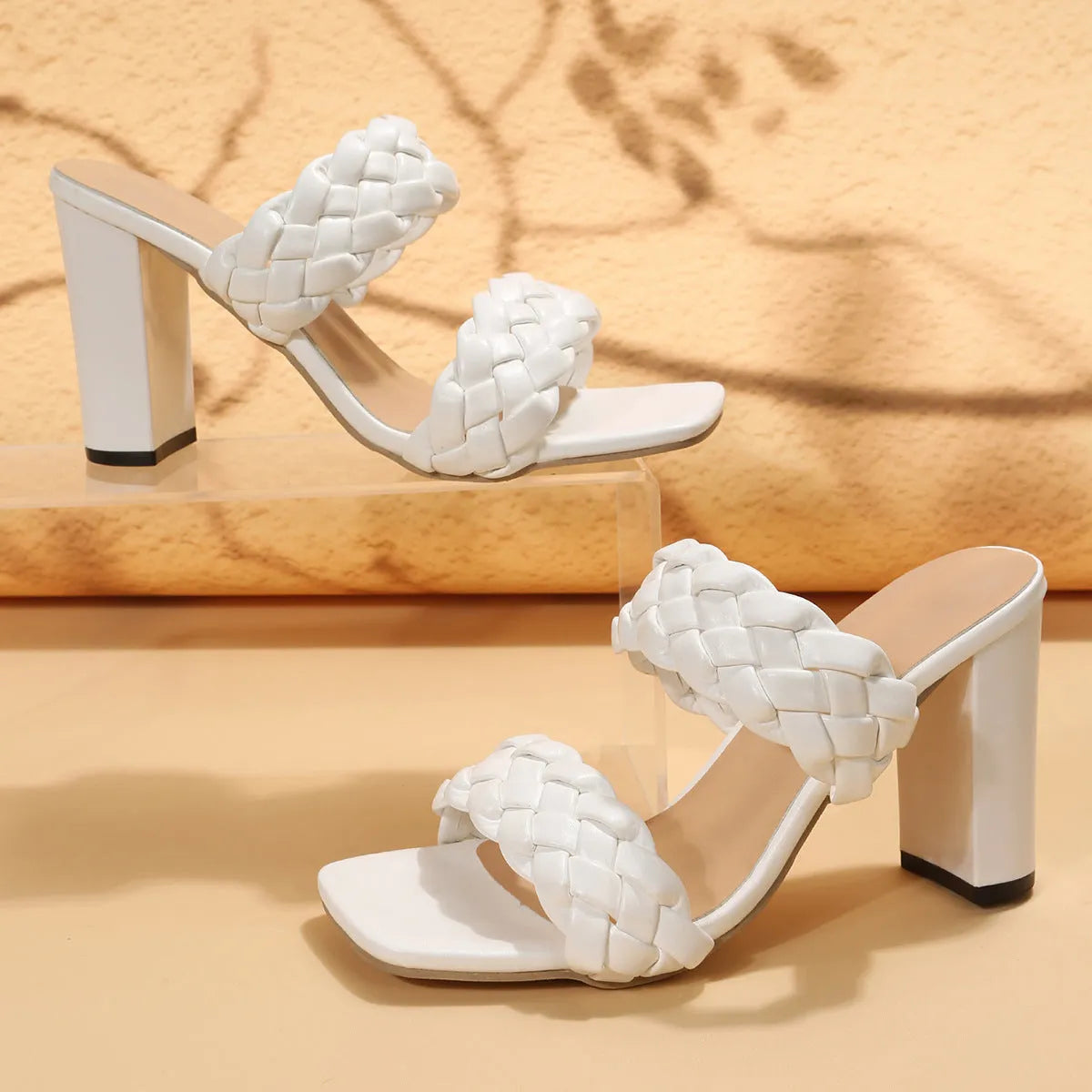 Square toe woven flip flops with chunky heel in apricot colour on a white background.
