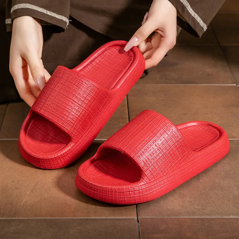 A pair of EVA toe ring slippers in a chosen colour, showing the soft non-slip sole and strap design.